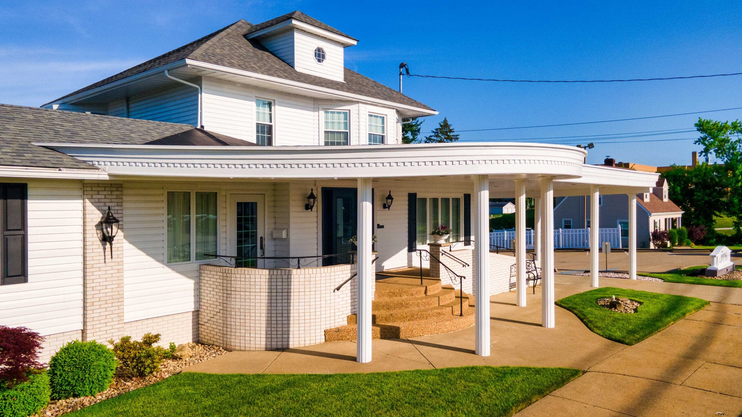 Shorac Funeral Home in Wintersville with its covered porch and sign